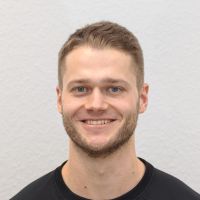 Lennart Stein - Business Development Assistant: Smiling man with short brown hair; short brown beard and blue eyes.