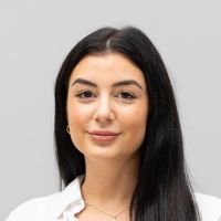Pia Pfeiffer - Sales Development Representative: Smiling woman with long black hair and dark brown eyes.