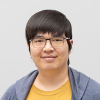 Wai Lun Wong - Data Scientist: Smiling man with square, thin, black glasses; black eyes and black hair falling as fringes on his forehead.